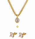 Gold necklace and earrings on a white background