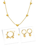 Gold necklace with heart-shaped pendants on a white background