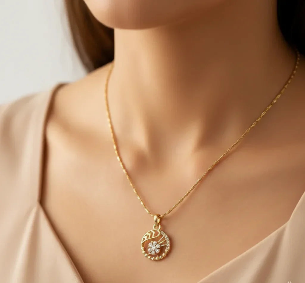 Gold necklace with a pendant on a mannequin