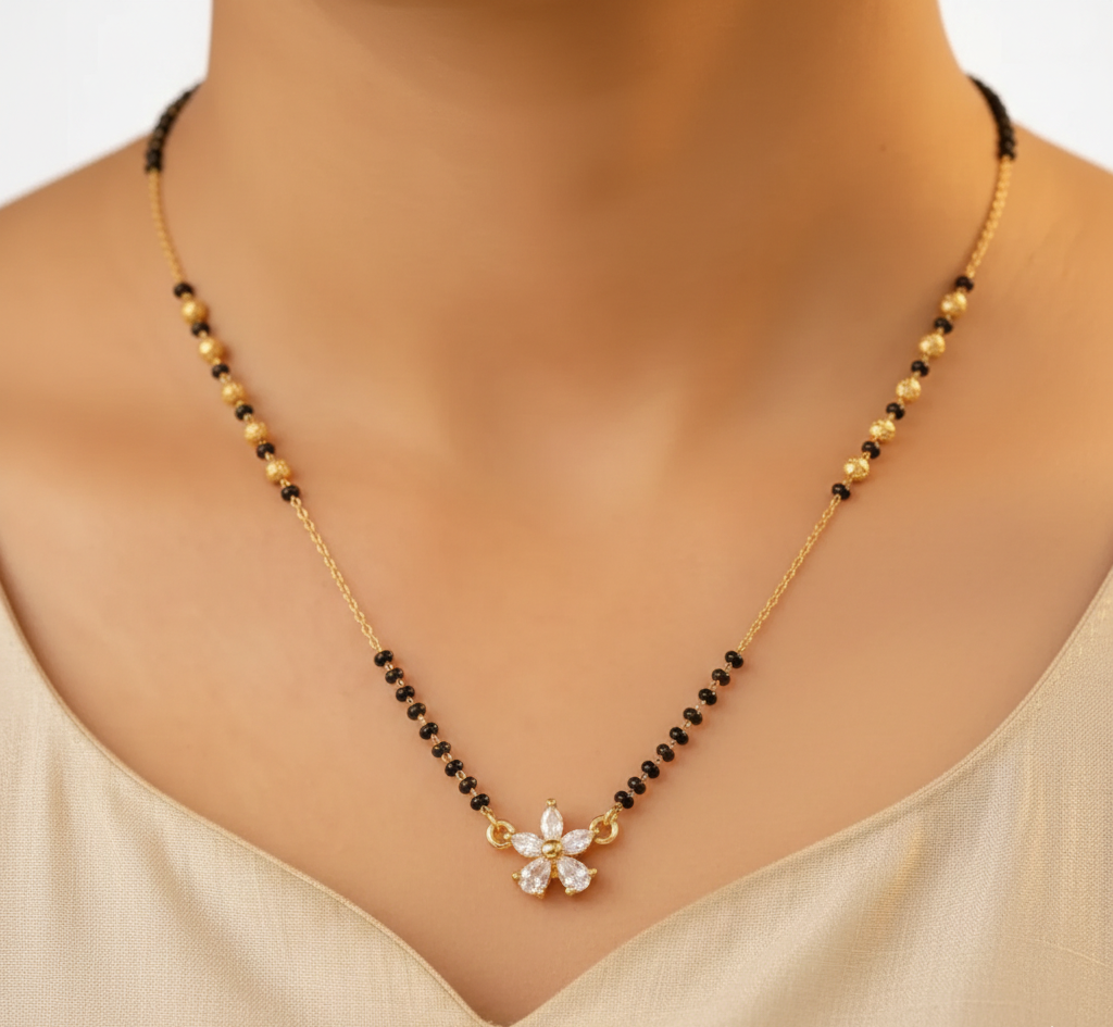 Necklace with black and gold beads on a mannequin