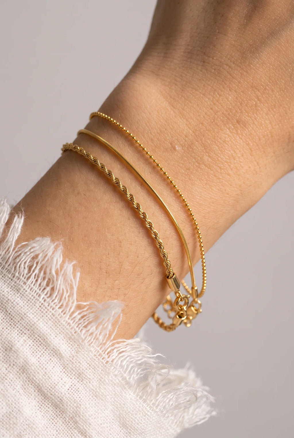 Three Sleek Chain Gold Bracelet