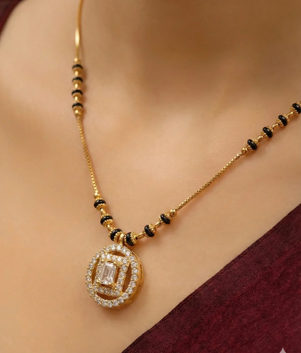 Gold necklace with a pendant on a mannequin