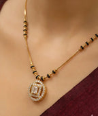 Gold necklace with a pendant on a mannequin