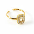 Gold ring with zircon on a white background