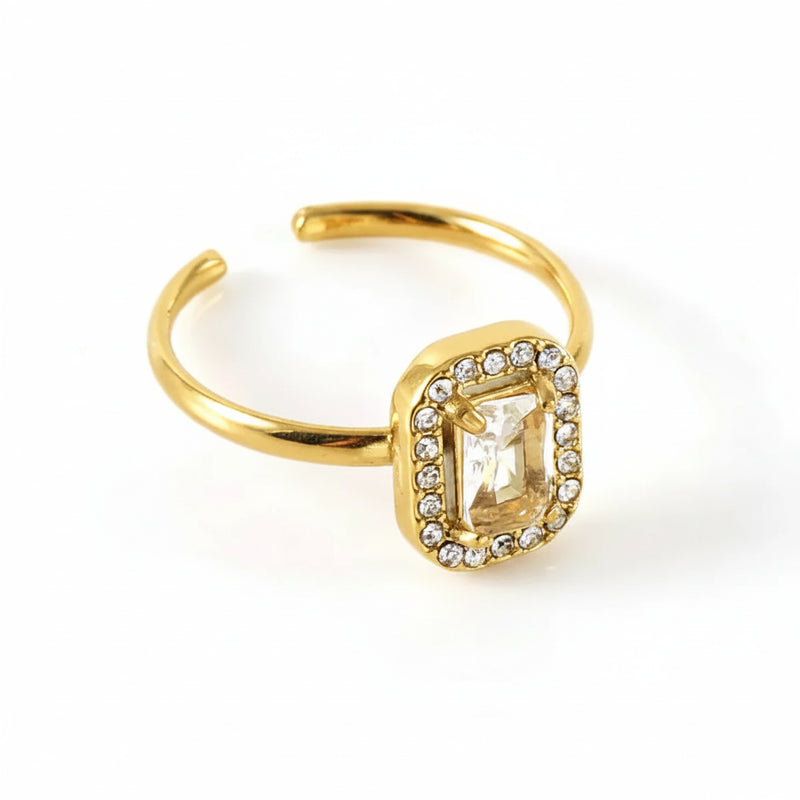 Gold ring with zircon on a white background