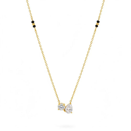 Gold necklace with a teardrop-shaped diamond pendant on a white background