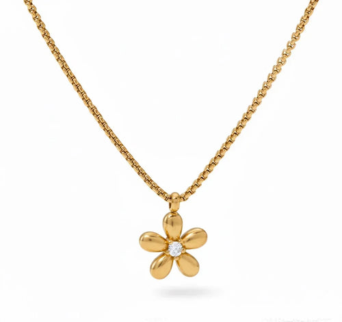 Gold flower-shaped pendant necklace on a white background
