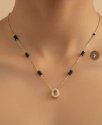 Necklace with a circular pendant on a neutral background