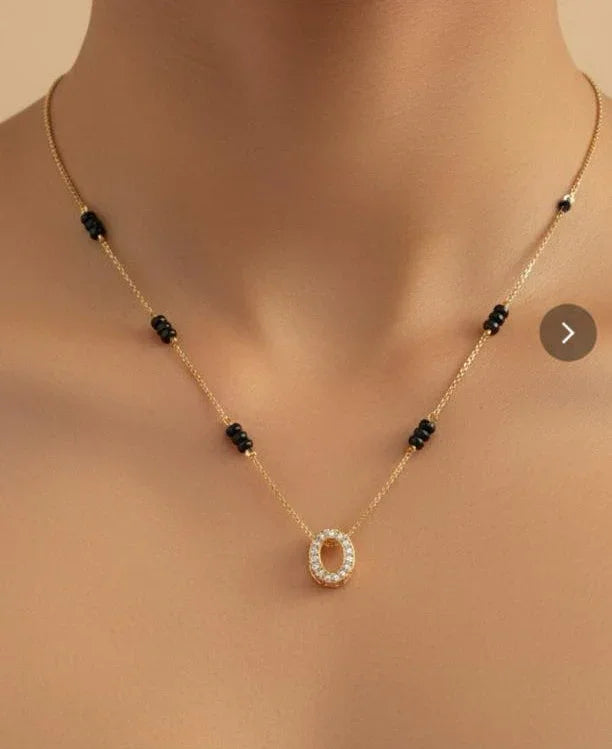 Necklace with a circular pendant on a neutral background