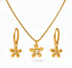 Gold flower-shaped jewelry set with necklace, earrings, and hoop earrings on a white background